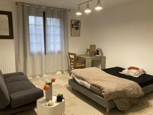 Postel nebo postele na pokoji v ubytování Chambre dans anciennes écuries