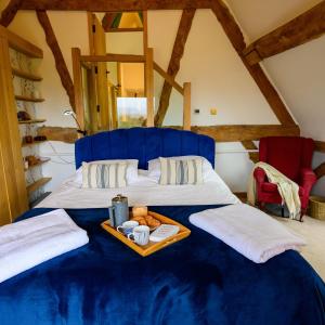 Postel nebo postele na pokoji v ubytování East Barn- Luxury Countryside Home