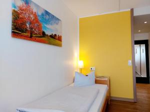 Postel nebo postele na pokoji v ubytování Heinrich Pesch Hotel