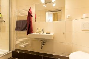 a bathroom with a sink and a mirror at 6 Windspiel in Rostock