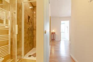 a bathroom with a shower and a walk in closet at 8 Meereswunder in Rostock +8 photos