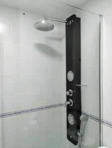 a shower with a glass door in a bathroom at Apartamento Puertomar in El Puerto de Santa María
