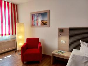 Postel nebo postele na pokoji v ubytování Heinrich Pesch Hotel