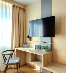 TV a/nebo společenská místnost v ubytování Heinrich Pesch Hotel