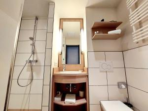 Koupelna v ubytování Heinrich Pesch Hotel