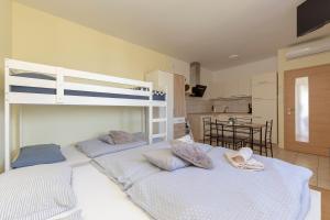 Postel nebo postele na pokoji v ubytování Apartma Vesna