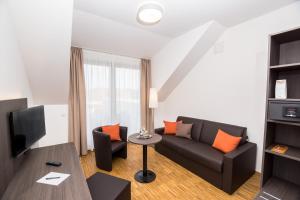 TV a/nebo společenská místnost v ubytování Stadthotel Reich