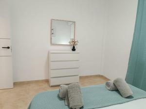 A bed or beds in a room at Vera Natura Apartamento Iker