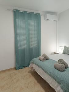 A bed or beds in a room at Vera Natura Apartamento Iker