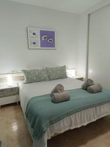 A bed or beds in a room at Vera Natura Apartamento Iker