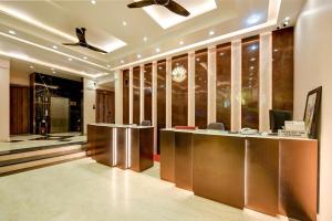 a lobby with a reception desk in a building at Hotel Pearl Plaza - Paharganj - New Delhi in New Delhi