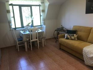 a living room with a couch and a table at Ático de Carmen in Cee