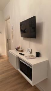 TV a/nebo společenská místnost v ubytování Sottocastello 1