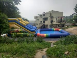a group of inflatable slides in a park at Ganghwado Baba Valley Pension in Incheon