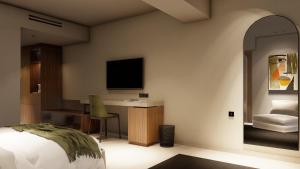 Alizo Comfort Chic Stay Rhodes - Adults Only tesisinde bir odada yatak veya yataklar