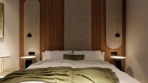 Alizo Comfort Chic Stay Rhodes - Adults Only tesisinde bir odada yatak veya yataklar