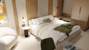 Alizo Comfort Chic Stay Rhodes - Adults Only tesisinde bir odada yatak veya yataklar