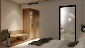 Alizo Comfort Chic Stay Rhodes - Adults Only tesisinde bir odada yatak veya yataklar