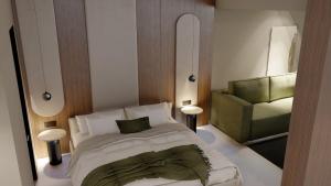 Alizo Comfort Chic Stay Rhodes - Adults Only tesisinde bir odada yatak veya yataklar