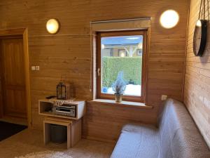 a living room with a window and a couch at Rojas Rodes in Roja