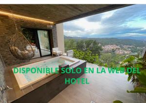 a villa with a swimming pool in a house at Petit Mirador in Torrelles de Llobregat