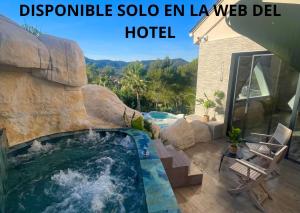 a swimming pool in the middle of a house at Petit Mirador in Torrelles de Llobregat