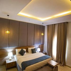 Postel nebo postele na pokoji v ubytování Prosbel Hotel