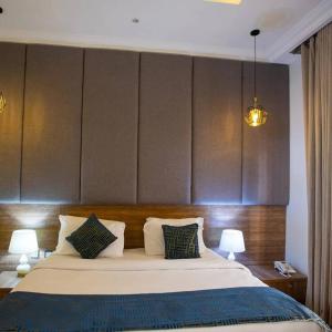 Postel nebo postele na pokoji v ubytování Prosbel Hotel