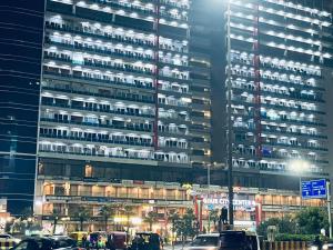 a large building with cars parked in front of it at Golden palace studio in Ghaziabad