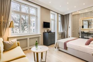 Posteľ alebo postele v izbe v ubytovaní Krupówki 17 Resort & SPA