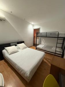 Voodi või voodid majutusasutuse Hotel Relais Sud toas