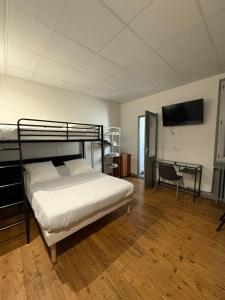 Voodi või voodid majutusasutuse Hotel Relais Sud toas