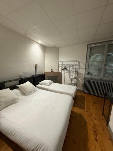Voodi või voodid majutusasutuse Hotel Relais Sud toas