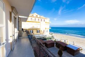 a balcony of a building with a view of the beach at XX Settembre 74 - Terrazza Sul Mare in Alassio