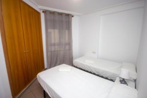Posteľ alebo postele v izbe v ubytovaní Style Apartment Patacona Beach