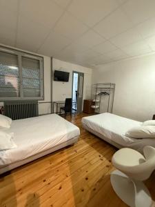 Voodi või voodid majutusasutuse Hotel Relais Sud toas