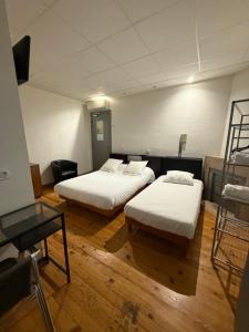 Voodi või voodid majutusasutuse Hotel Relais Sud toas