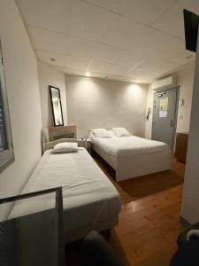 Voodi või voodid majutusasutuse Hotel Relais Sud toas