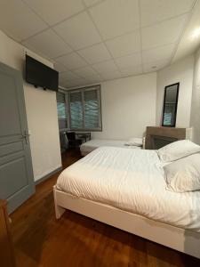 Voodi või voodid majutusasutuse Hotel Relais Sud toas
