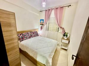 Ένα ή περισσότερα κρεβάτια σε δωμάτιο στο Nice apartment by the beach