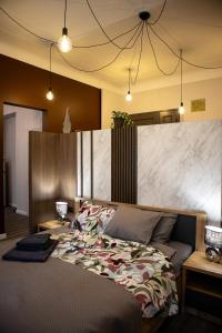 Postel nebo postele na pokoji v ubytování Baznicas Aparts Quiet Center