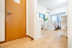 Postel nebo postele na pokoji v ubytování 冬5GWifi TokyoDome皇居1kmRoofGarden 上野秋葉原銀座東京2km