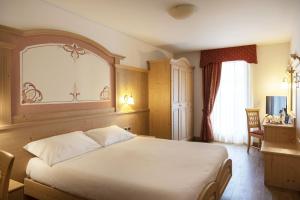 Voodi või voodid majutusasutuse Beverly Alps Hotel & Spa toas