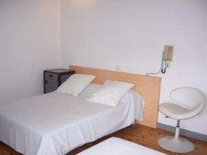 Voodi või voodid majutusasutuse Hotel Relais Sud toas