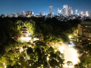 a view of a city at night at Hotel Chinzanso Tokyo in Tokyo