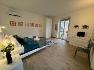TV a/nebo společenská místnost v ubytování Albergo Tenco by Bottega