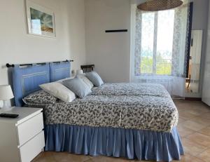 A bed or beds in a room at Agriturismo valsiniga