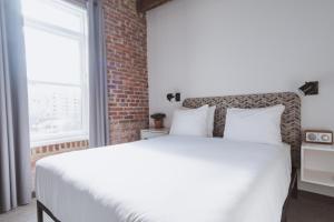 Postel nebo postele na pokoji v ubytování Hotel Hive