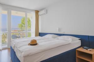 Postel nebo postele na pokoji v ubytování Paviljoni Slaven