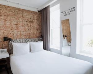 Postel nebo postele na pokoji v ubytování Hotel Hive